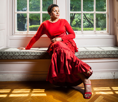 Carmen Balthrop sitting in a bay window